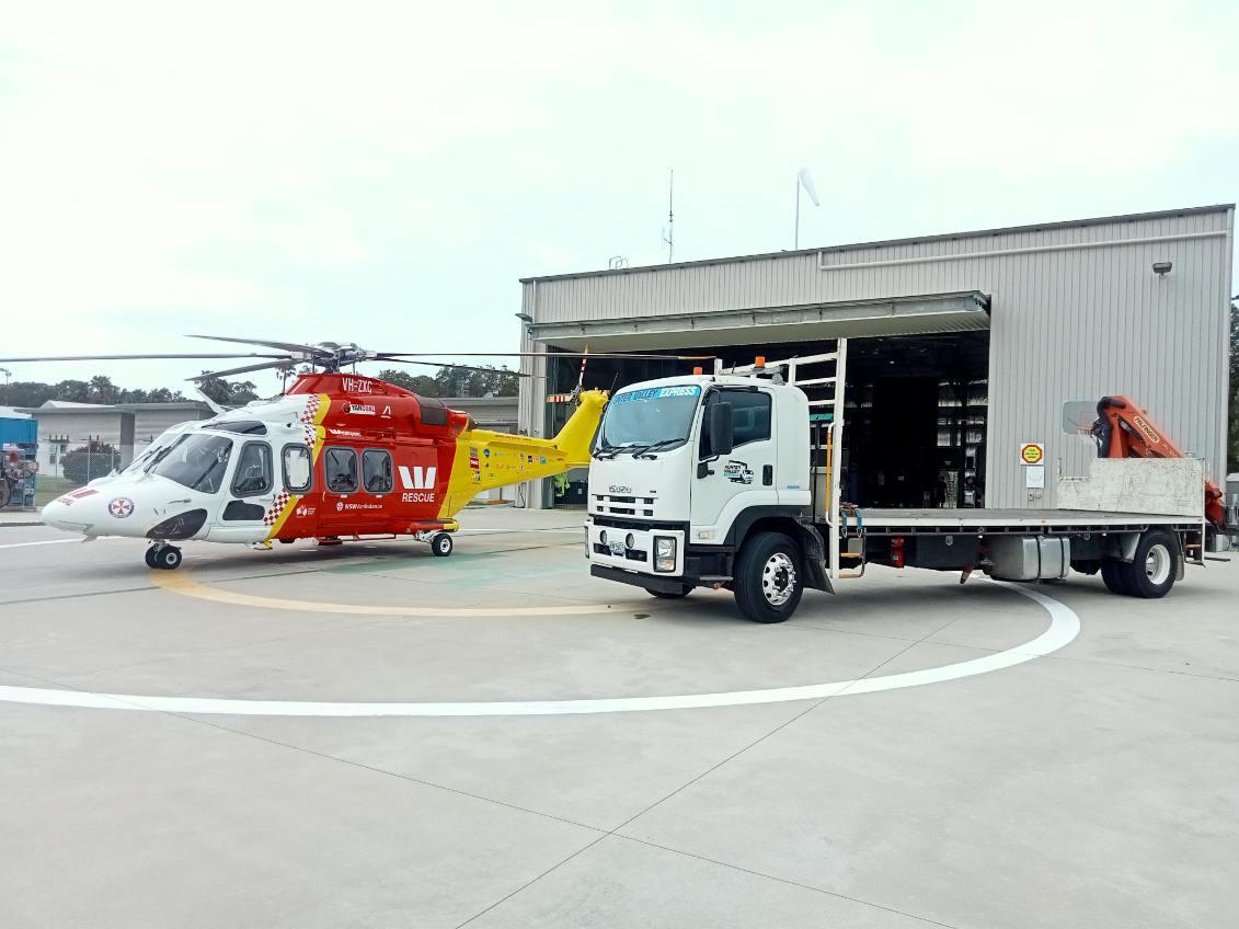 Crane truck unloading shoring equipment